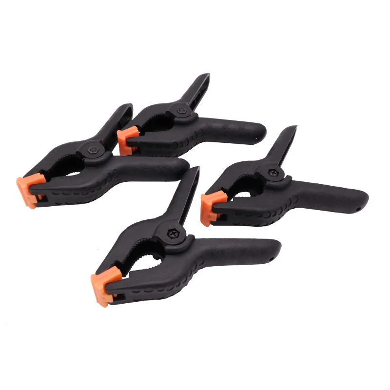 Caruba Clip de Fond Noir / Orange Petit (4 Pièces)